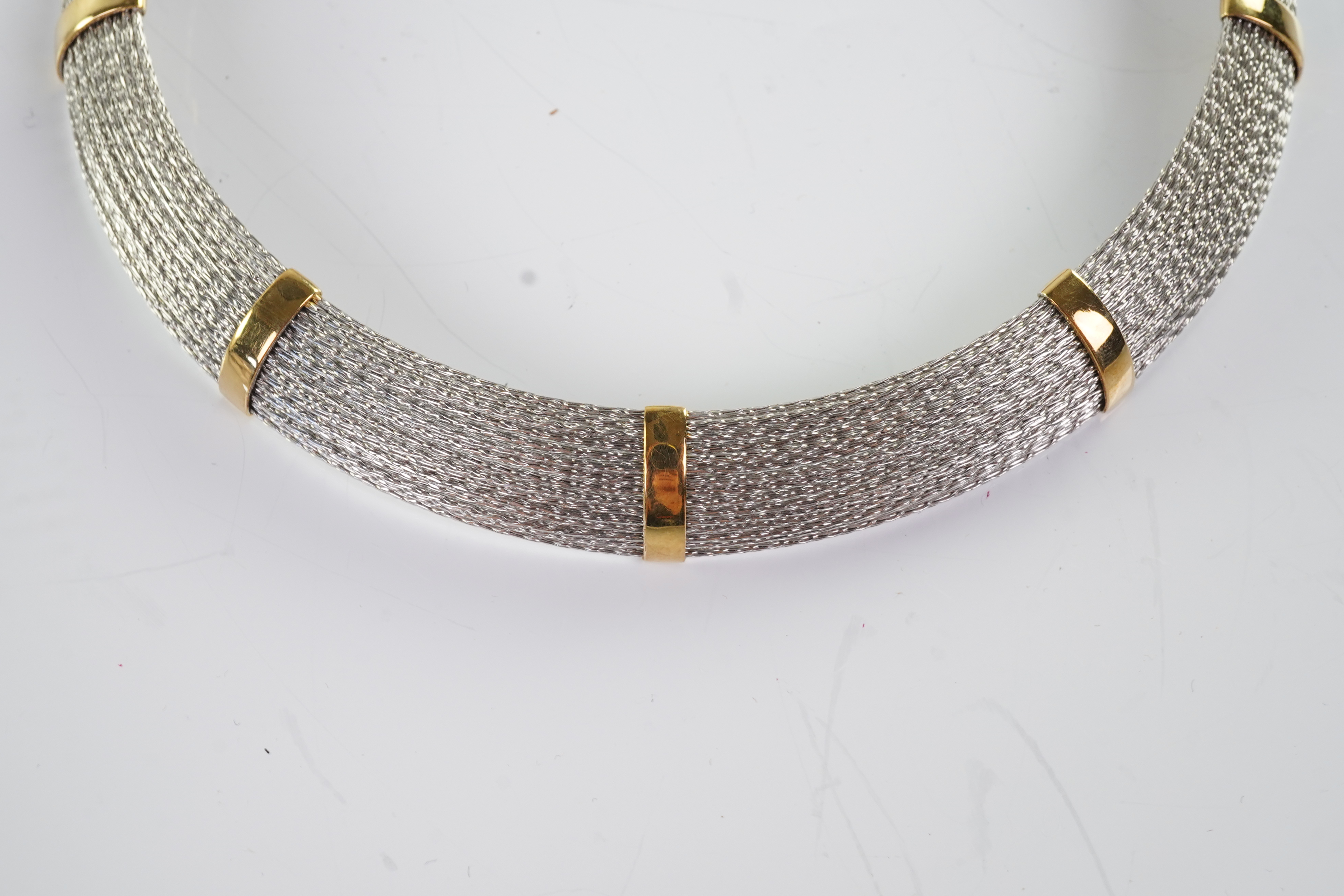 An 18ct gold collar and bangle